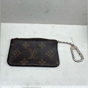 Authentic Louis Vuitton Cles key pouch coin holder in Monogram LV